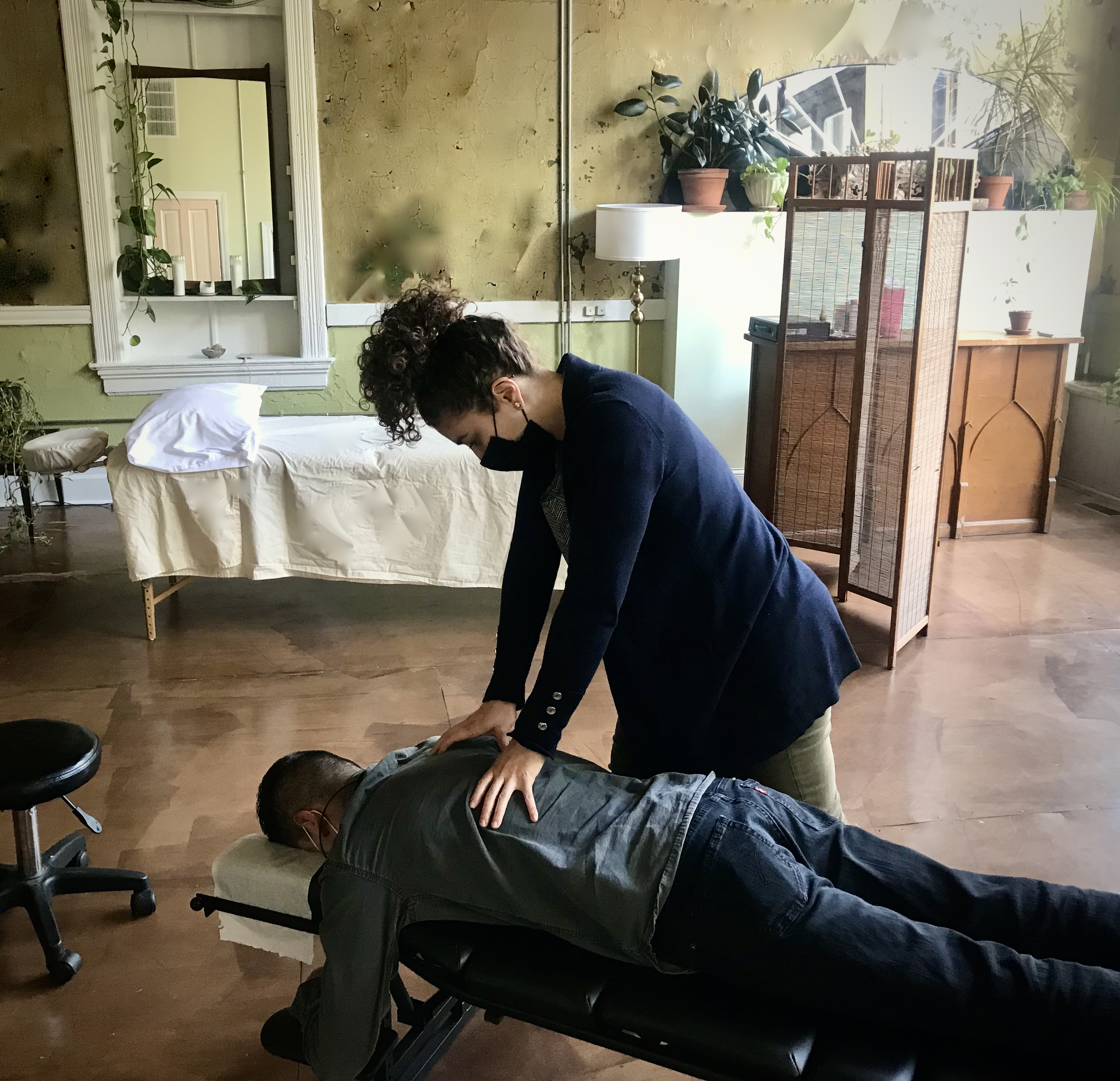 Dr. Lupe performs a chiropractic adjustment