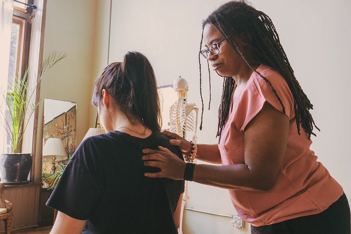 Chiropractic posture assessment at Sanctuary Health focused on whole-body alignment.